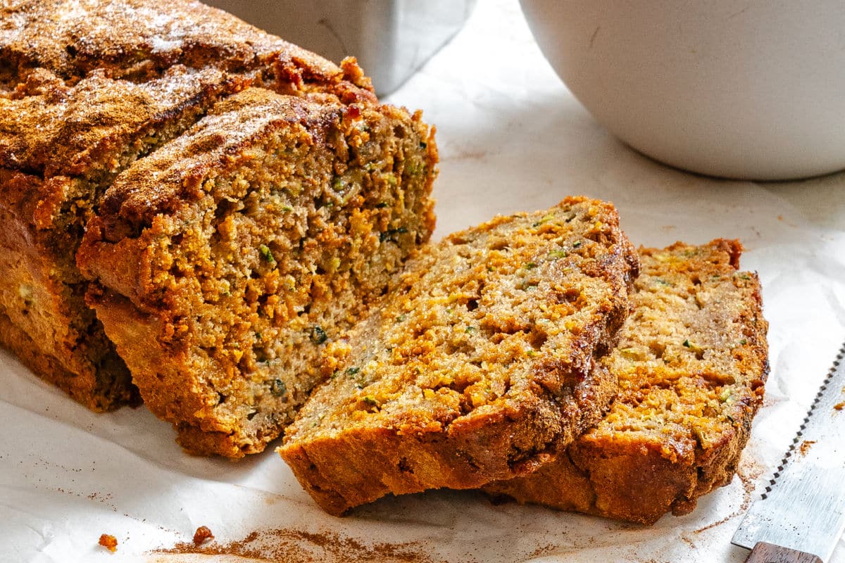 Cinnamon Chip Whole Wheat Zucchini Bread Slices of whole wheat zucchini bread leaning against the loaf.