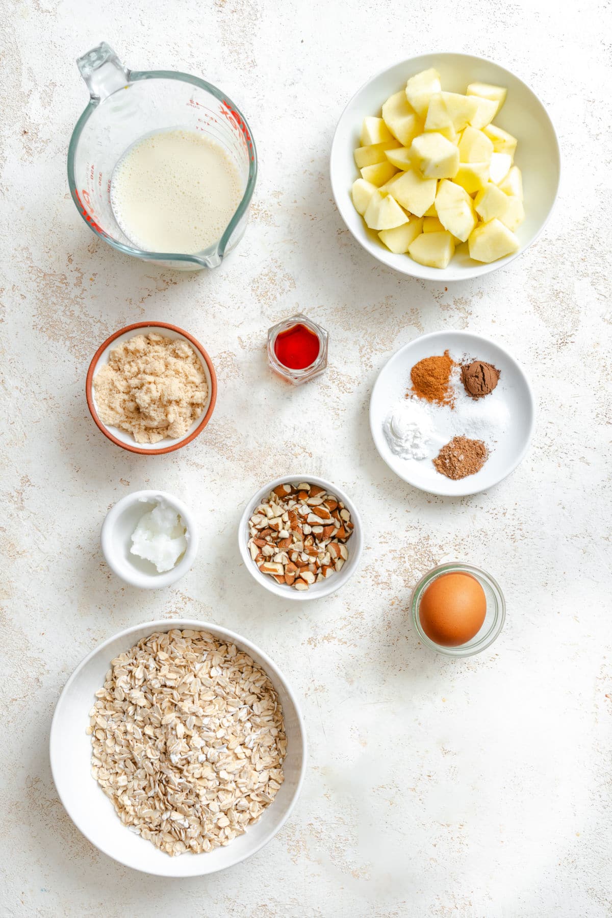 Individual Apple Crisp Oatmeal Ingredients for apple crisp oatmeal in dishes.