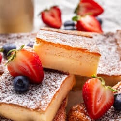 Cut pieces of magic cake stacked on top of each other.