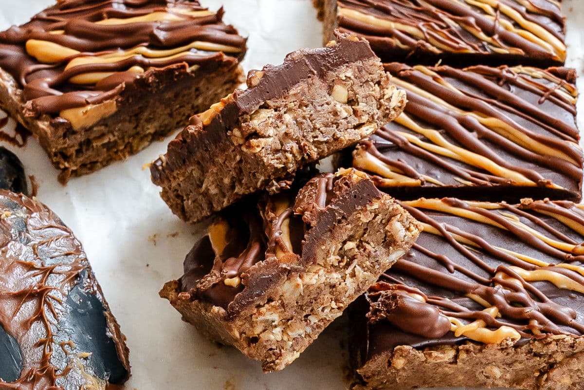 Two no bake cookie bars at an angle next to the rest of the bars.