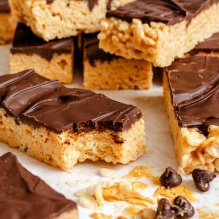 The peanut butter treats CRISPES rice A pile of peanut butter rice Krisples is treated with a missing bite.