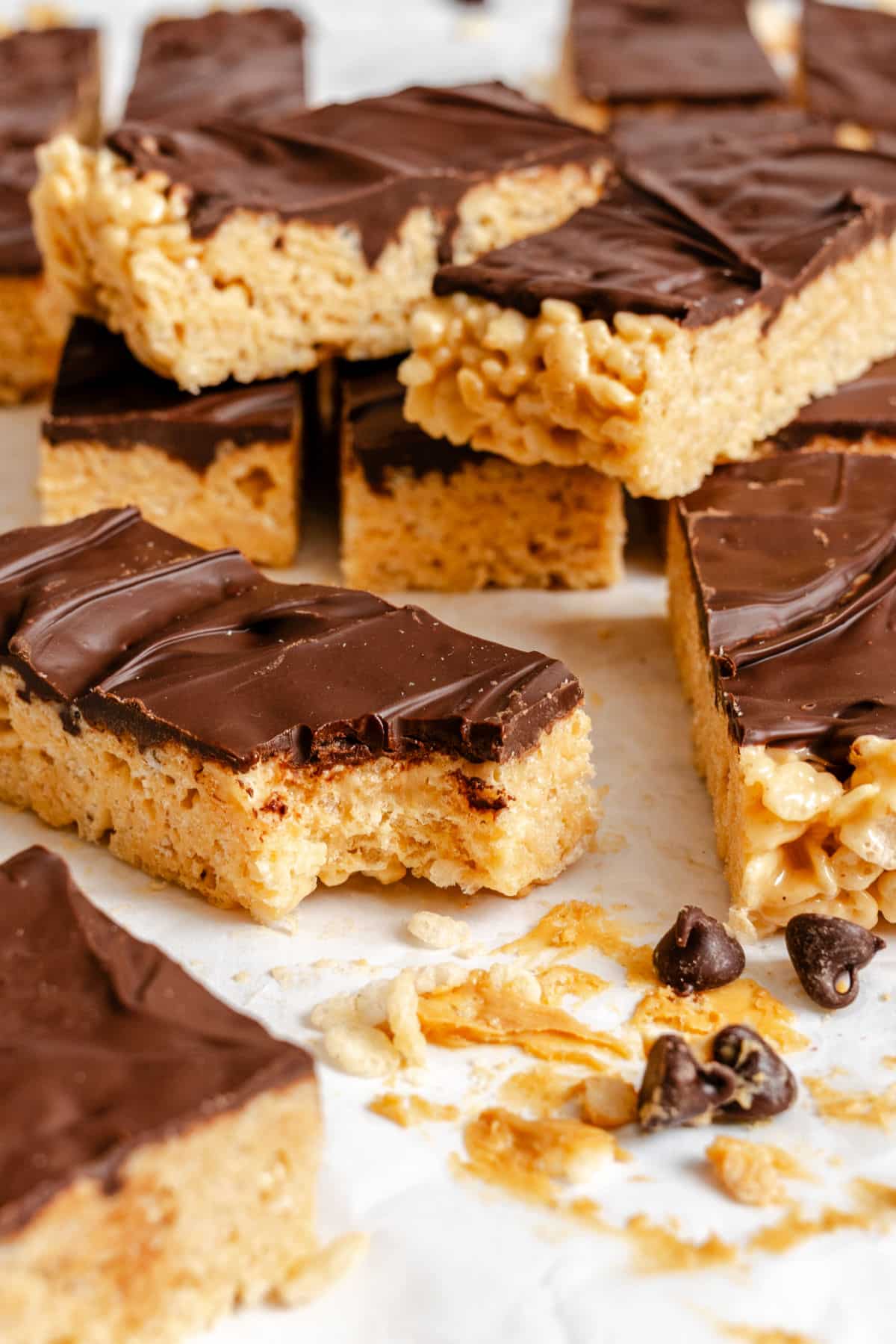 The peanut butter treats CRISPES rice A pile of peanut butter rice Krisples is treated with a missing bite.