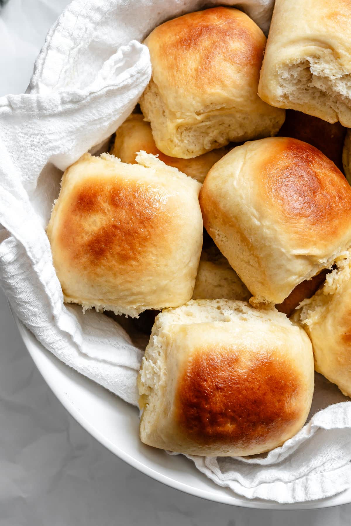 60 Minute Hawaiian rolls in a towel lined basket.
