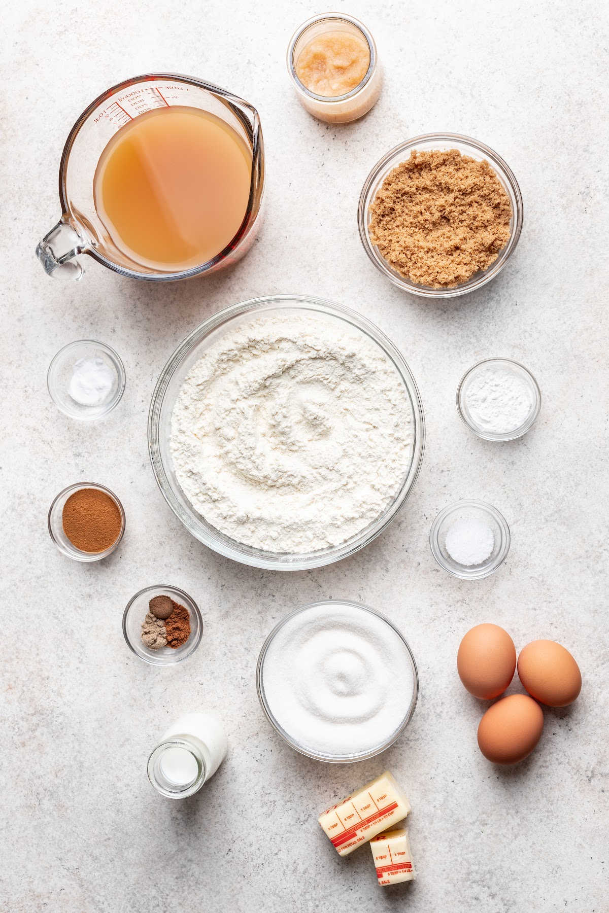Ingredients for apple cider donuts in dishes. 