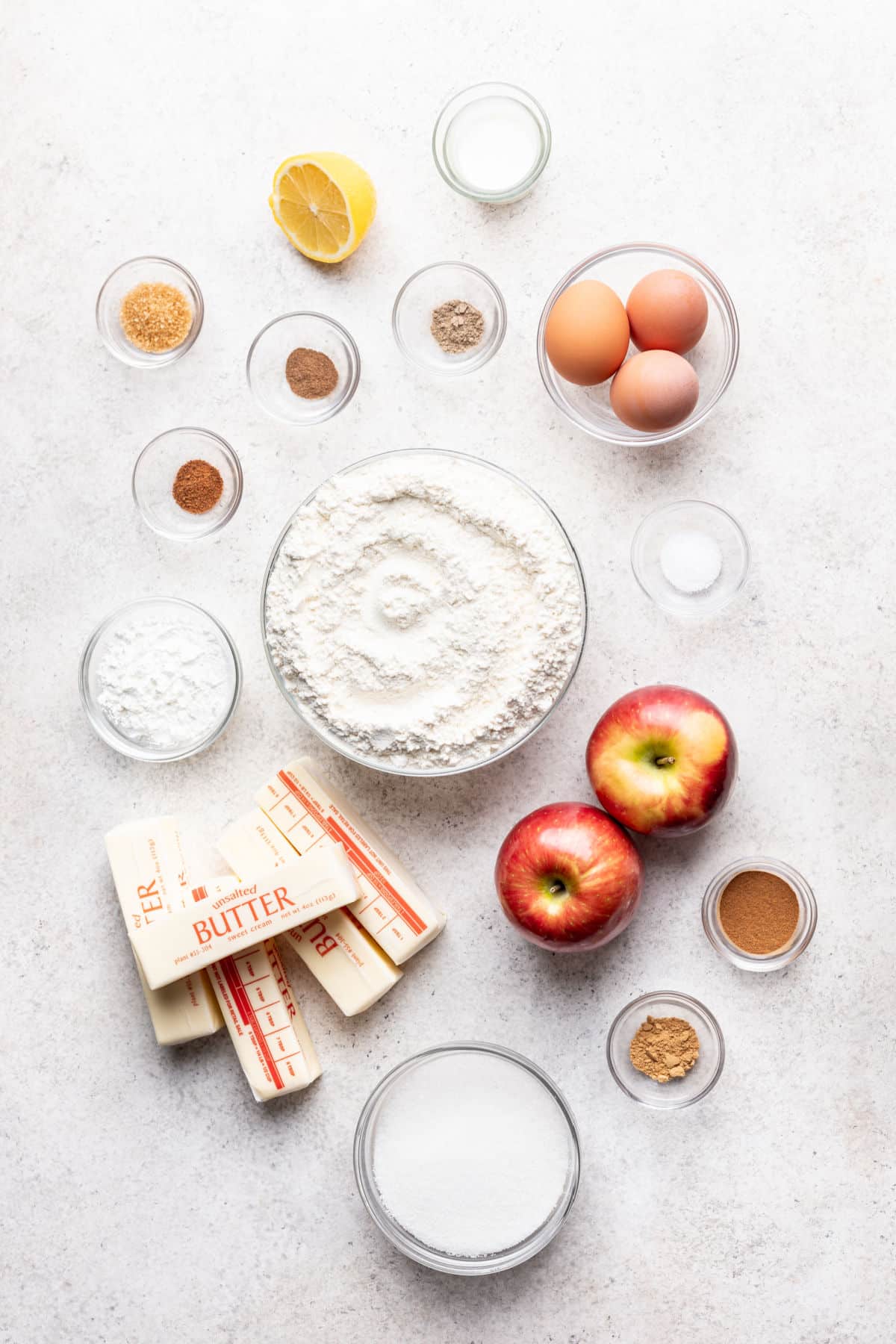 Ingredients for apple slab pie in dishes. 