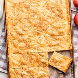 Apple slab pie with a pie at an angle on a server.