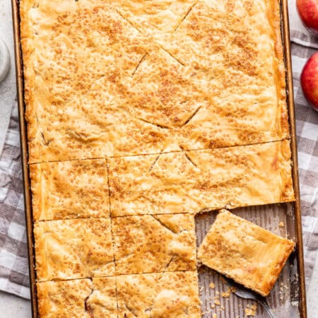Apple slab pie with a pie at an angle on a server.