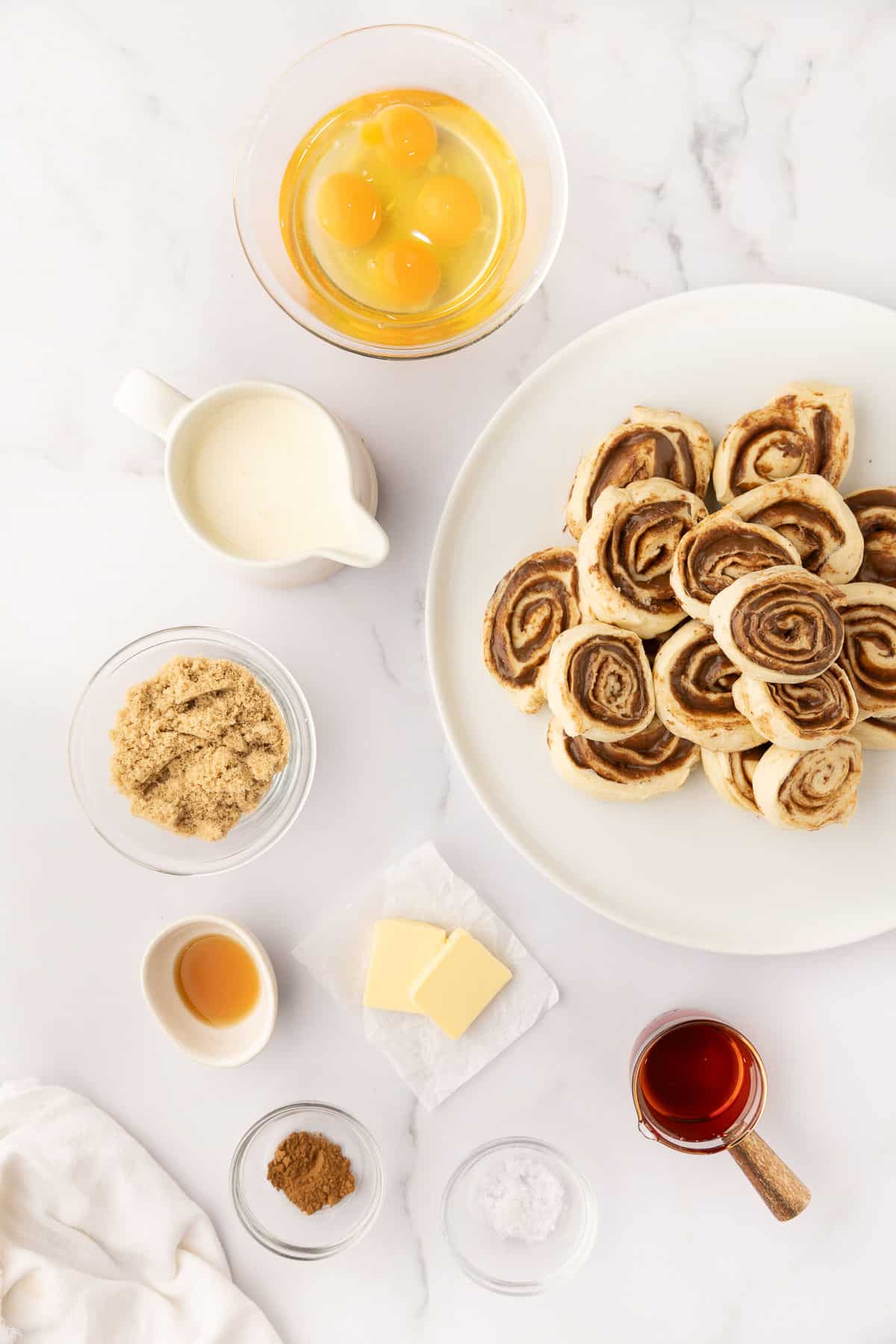 Ingredients for cinnamon roll casserole in dishes.