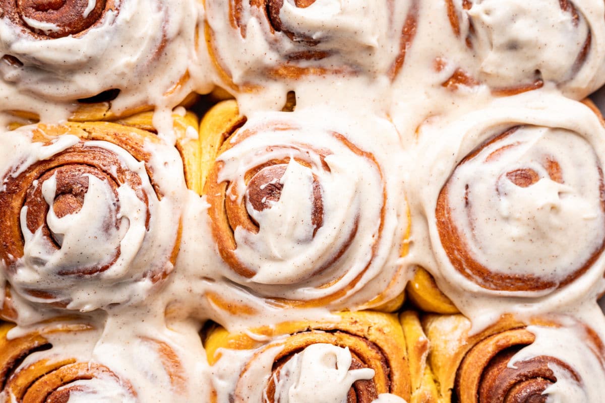 Frosted pumpkin cinnamon rolls.