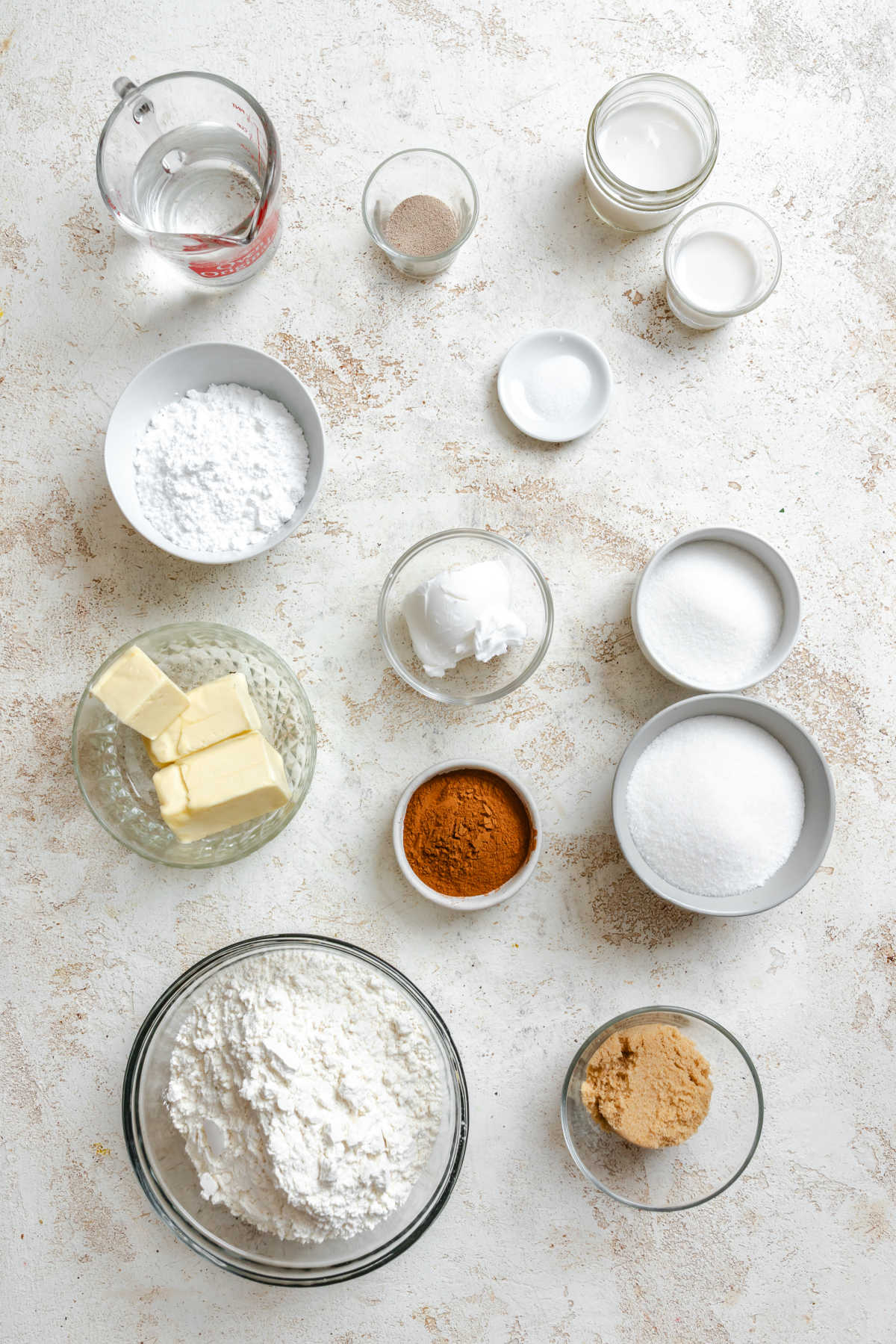 Ingredients for slow cooker cinnamon rolls in dishes.