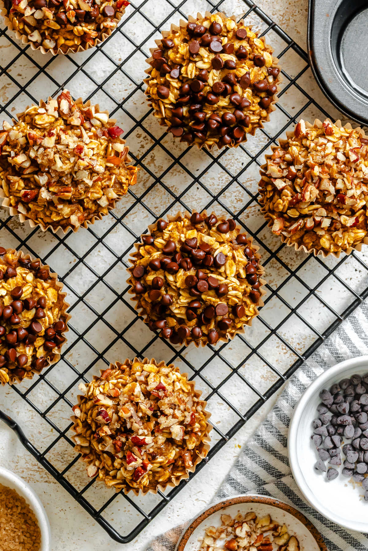 Rows of baked pumpkin oatmeal cups on a wire rack.