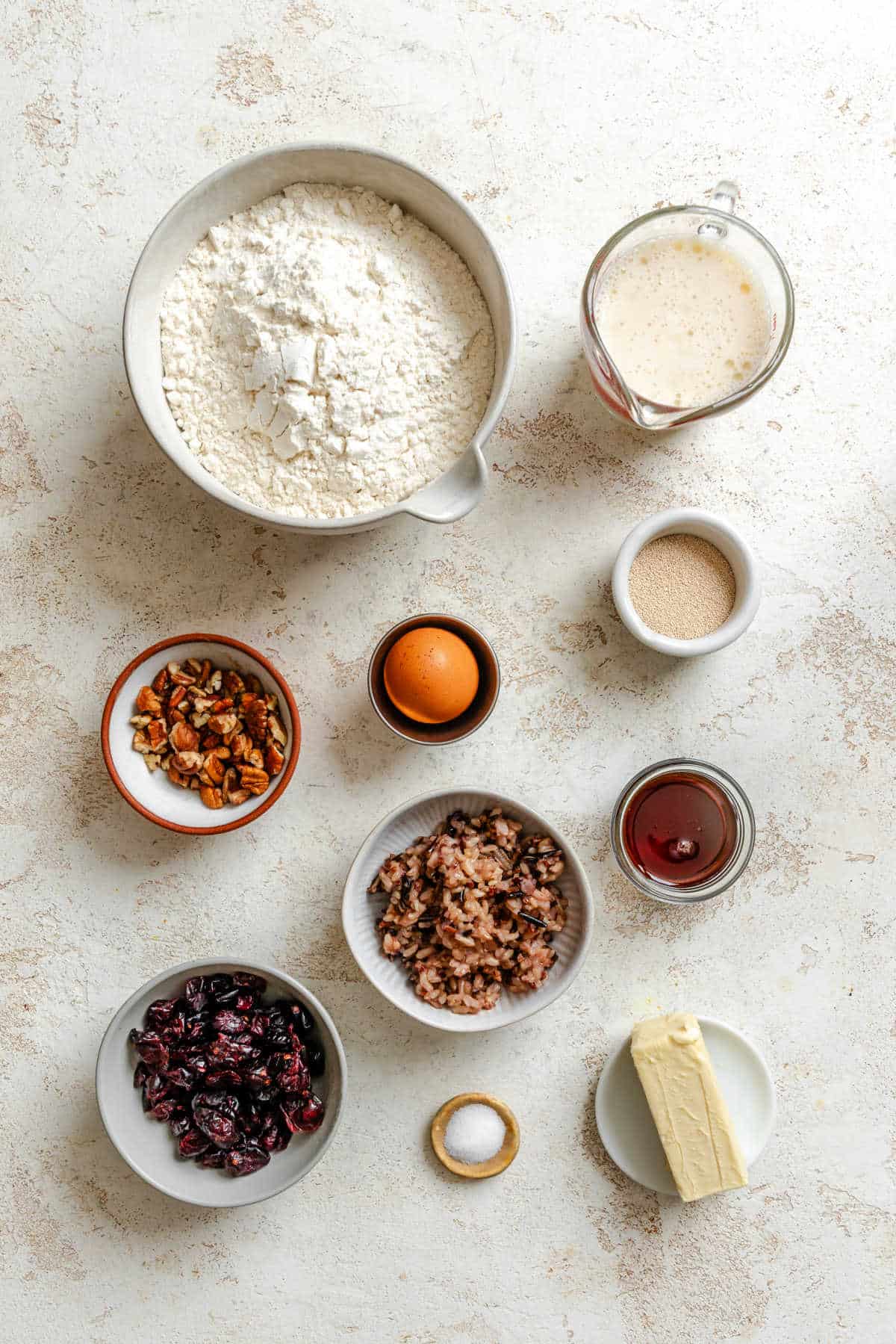 Ingredients for cranberry wild rice rolls in dishes. 