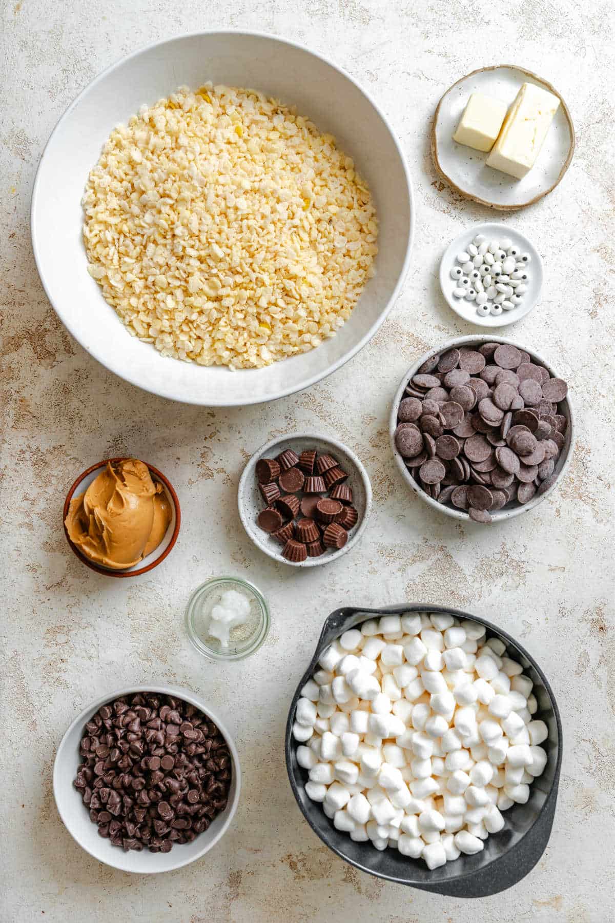 Ingredients for Halloween Rice Krispies treats in dishes. 