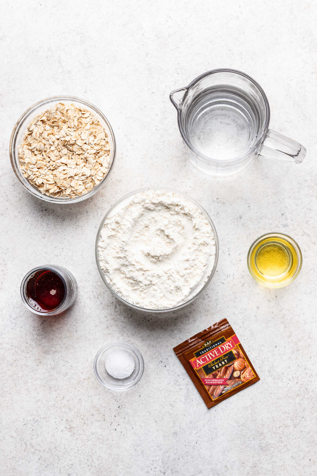 Ingredients for maple oat skillet bread in dishes.
