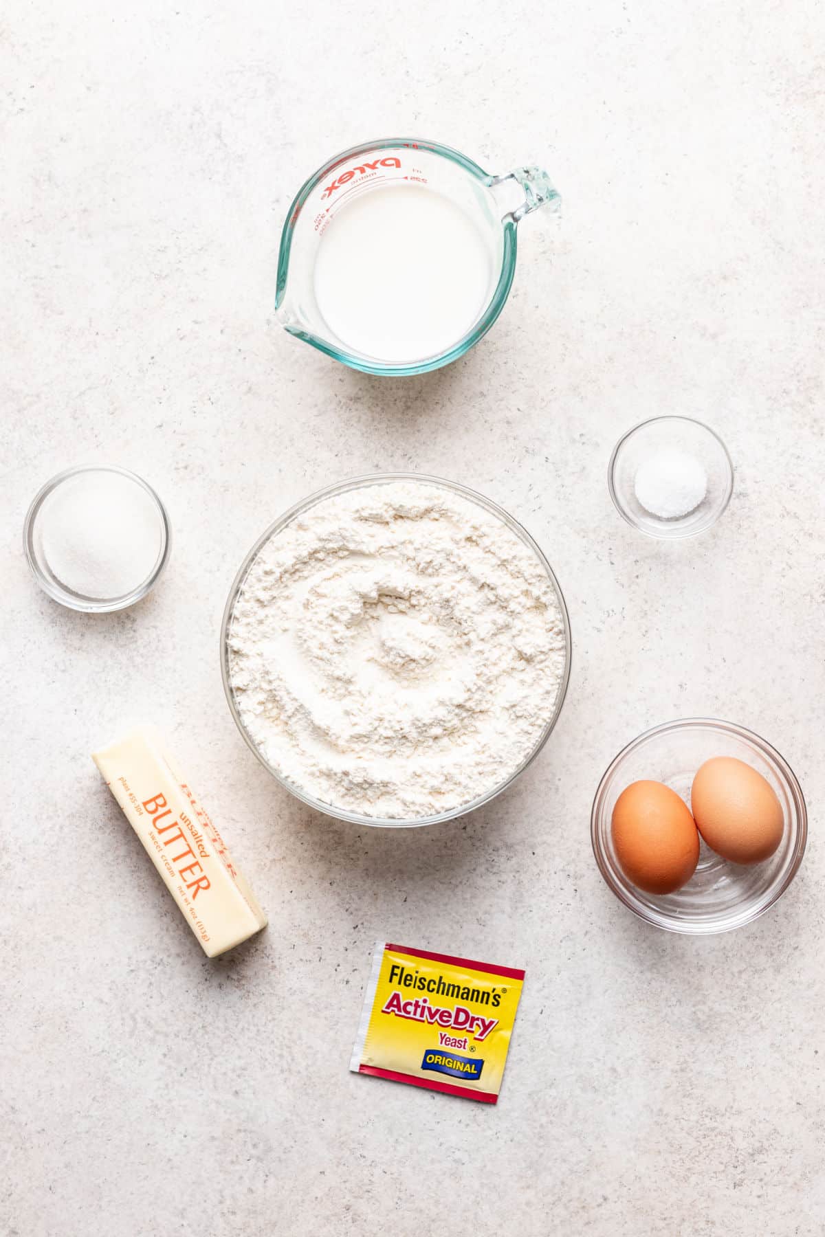 Ingredients for parker house rolls in dishes.