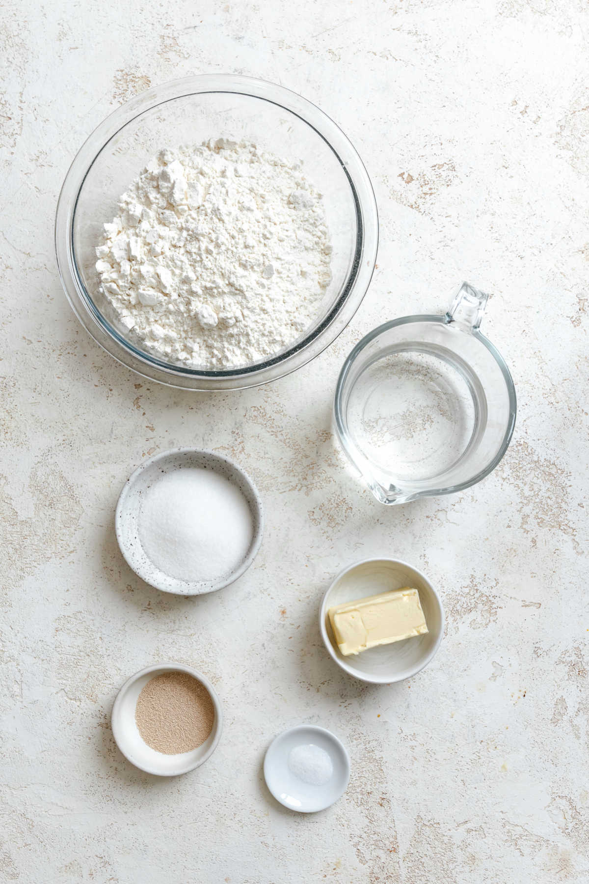 Ingredients for slow cooker dinner rolls in dishes. 