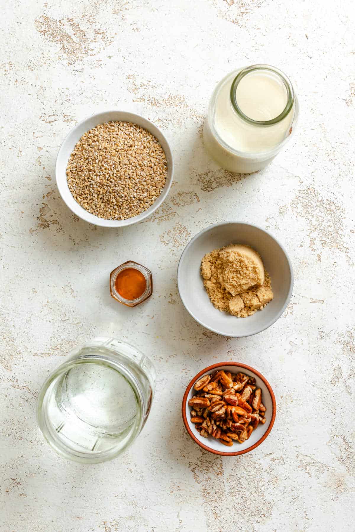 Ingredients for pecan pie oatmeal in dishes. 