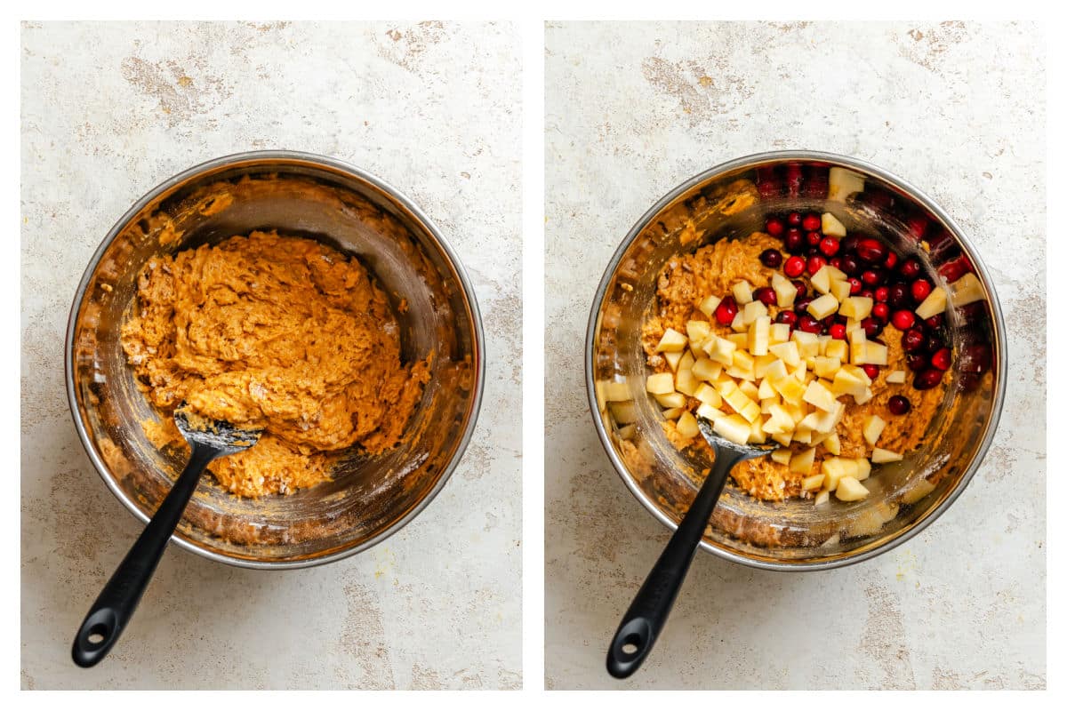 Pumpkin muffin batter in a mixing bowl next to diced apple and cranberries on the batter. 