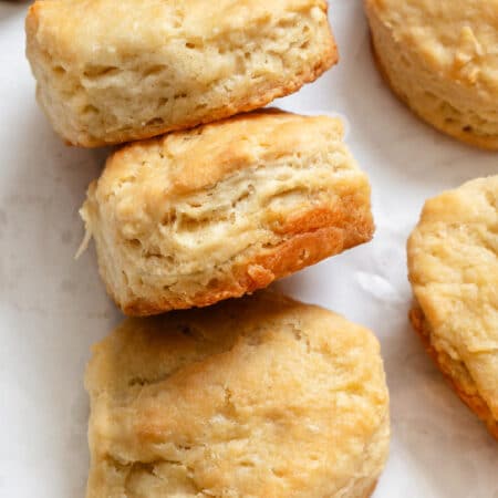 Three 3 ingredients biscuits on their side in a row.