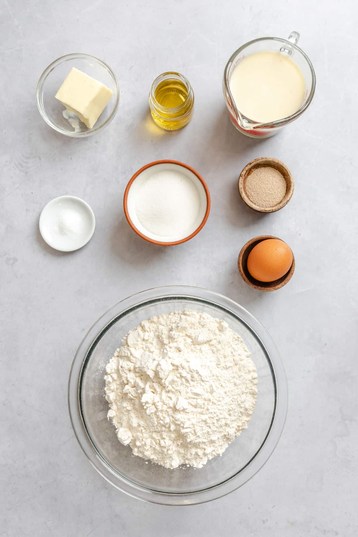 Ingredients for bread machine dinner rolls in dishes. 