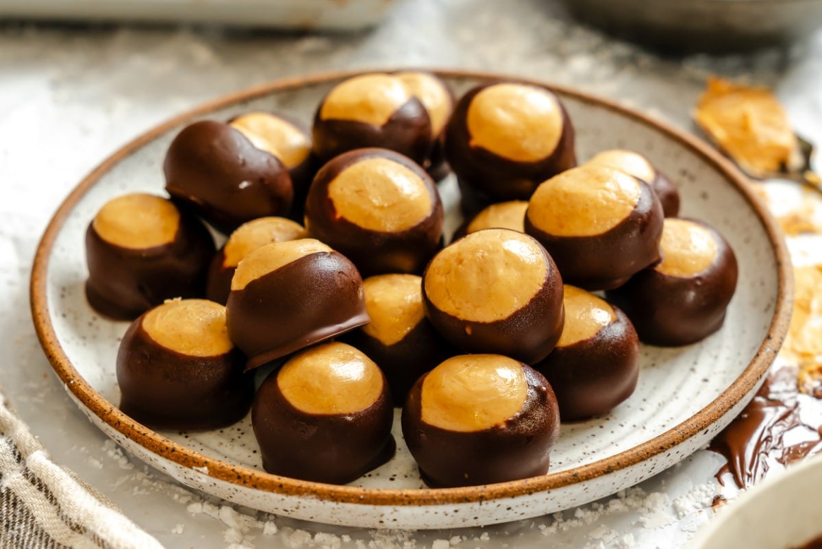 A plate stacked with buckeyes candy.