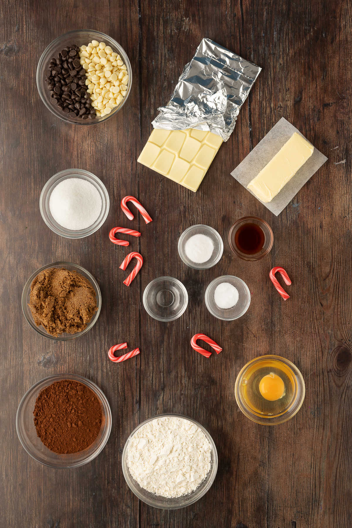 Ingredients for chocolate candy cane cookies in dishes. 