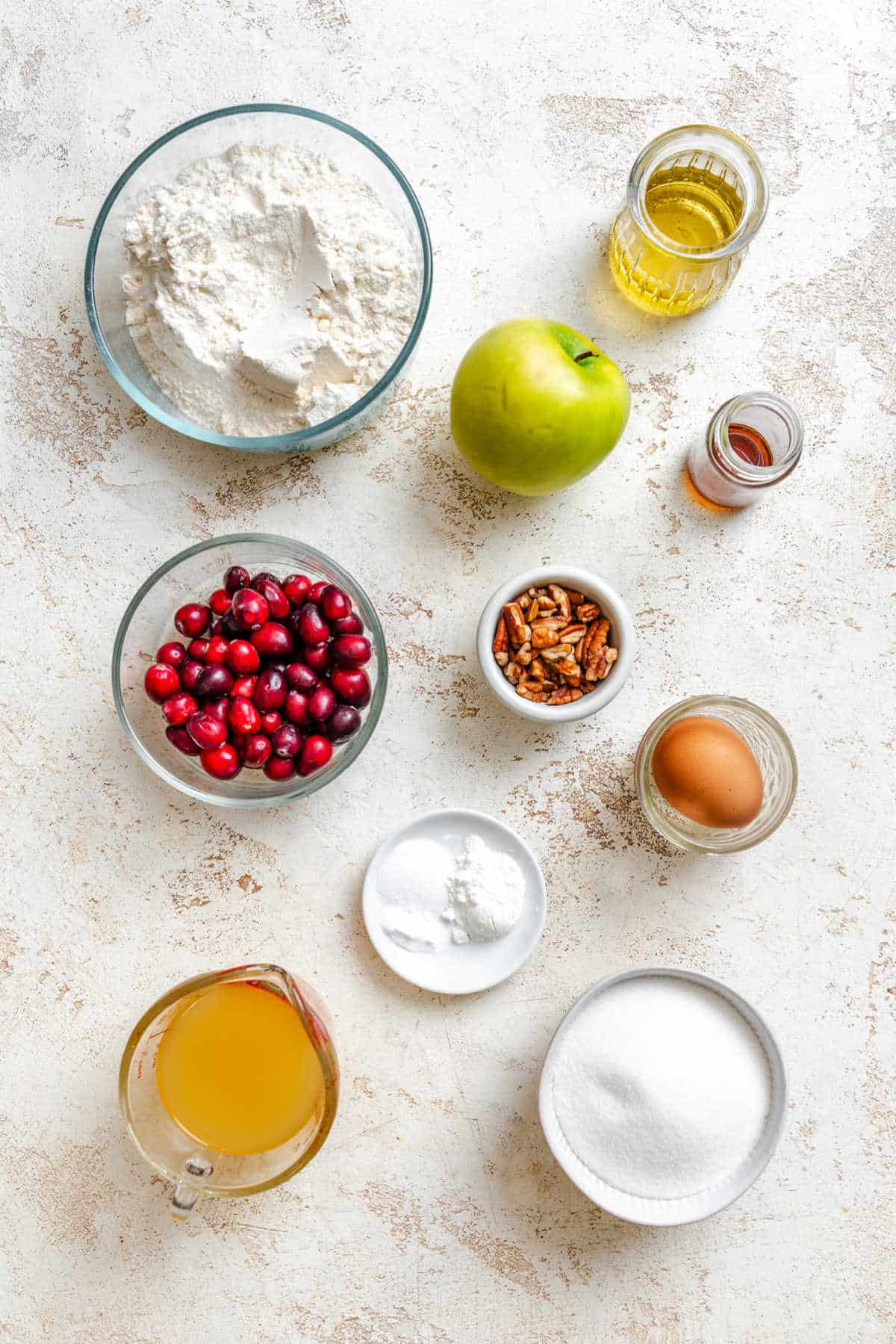 Ingredients for cranberry apple bread in dishes.