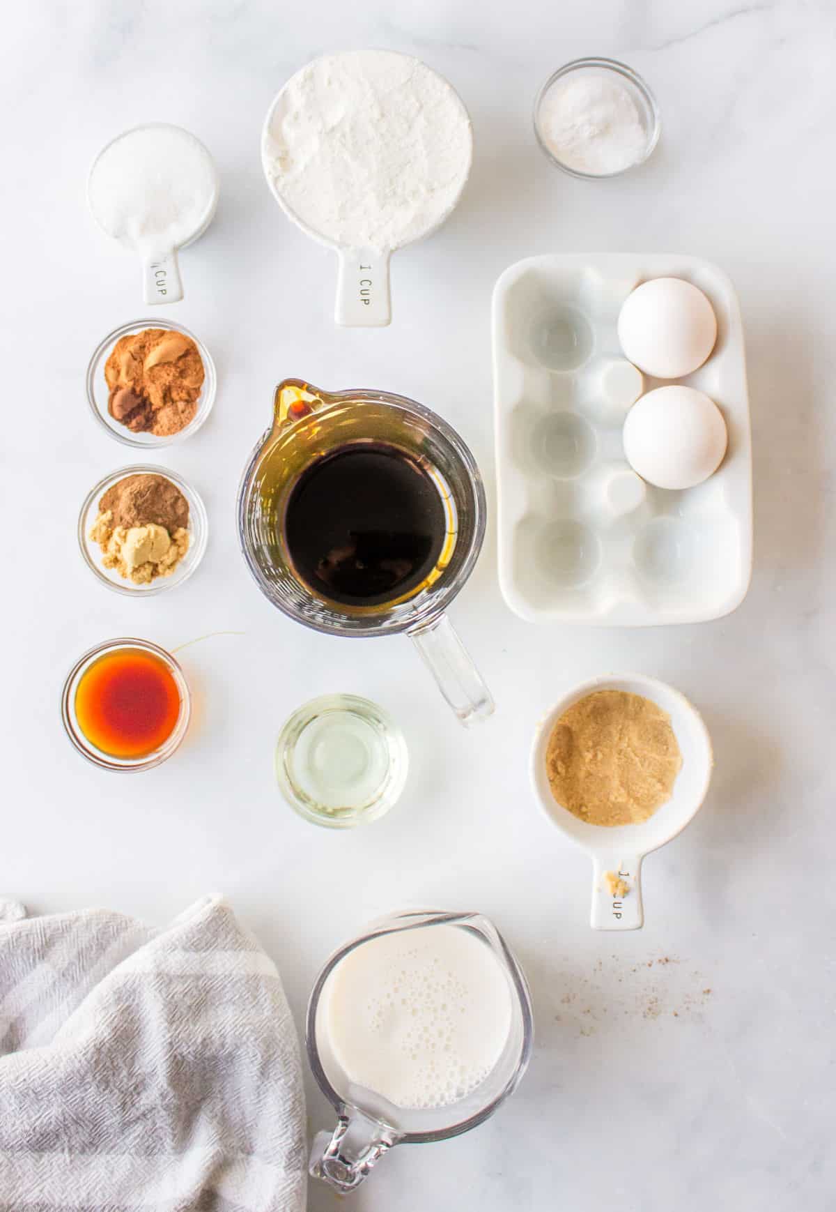Ingredients for gingerbread waffles in dishes.