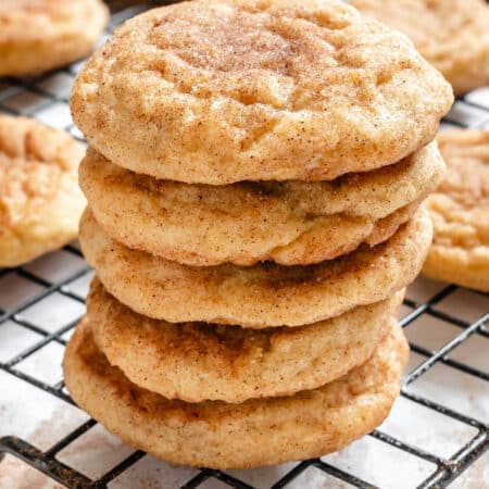 Five snickerdoodle cookies stacked on top of each other.