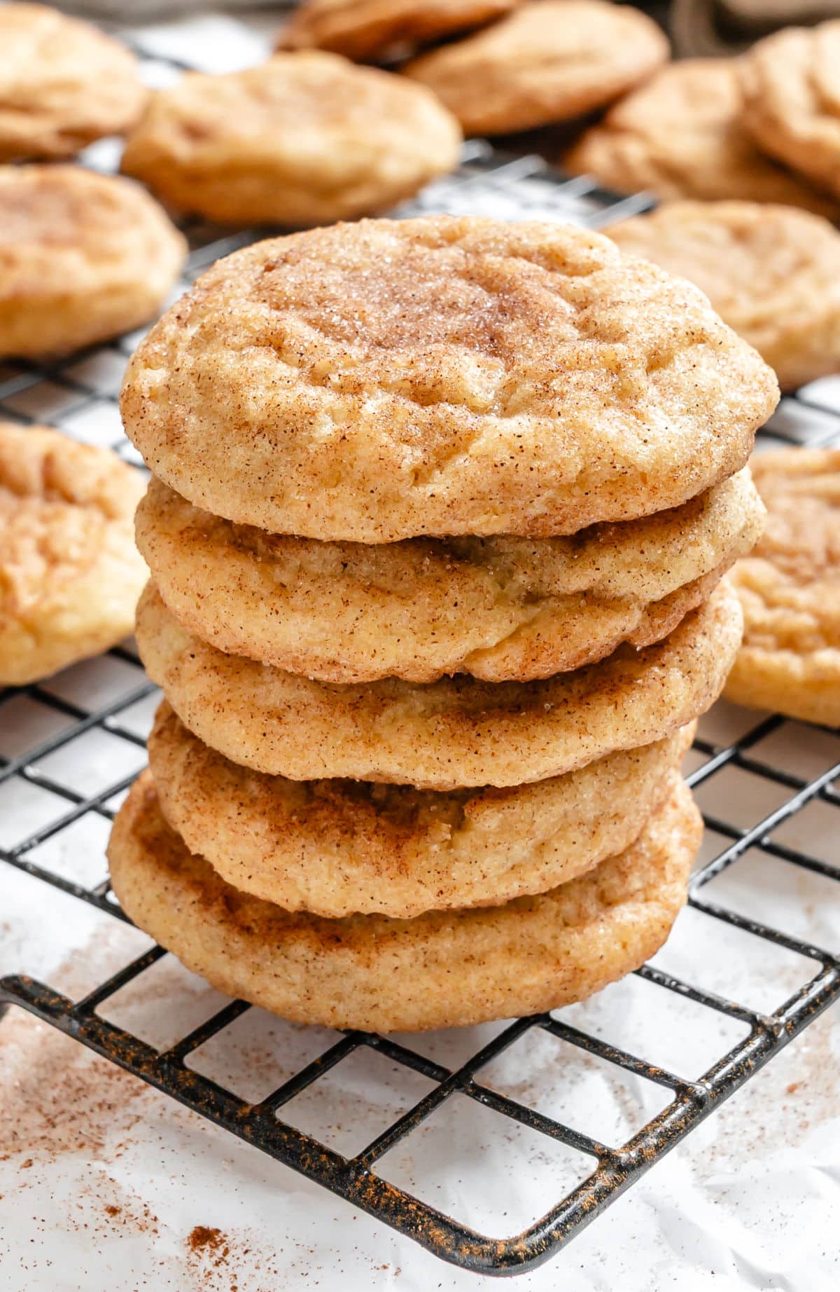 Chewy Snickerdoodle Cookies Five snickerdoodle cookies stacked on top of each other.