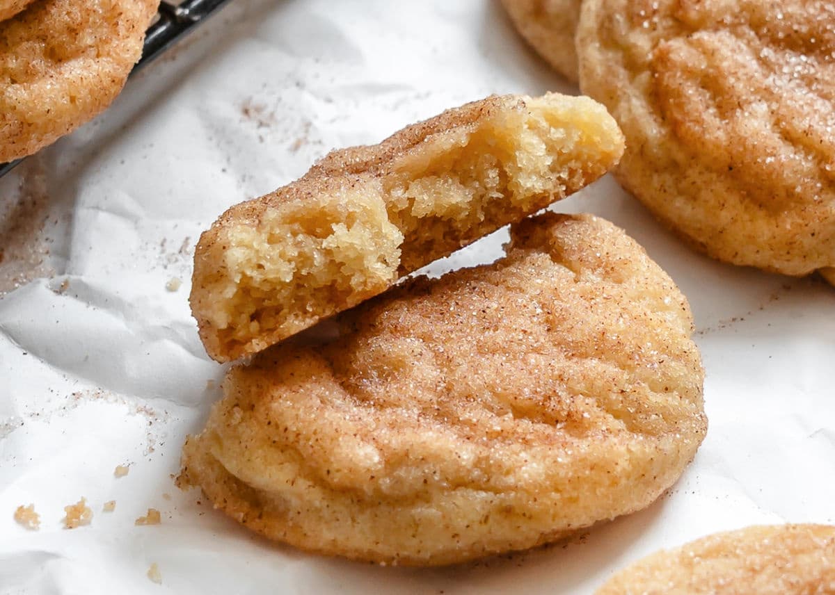 A snickerdoodle broken in half on top of each other.