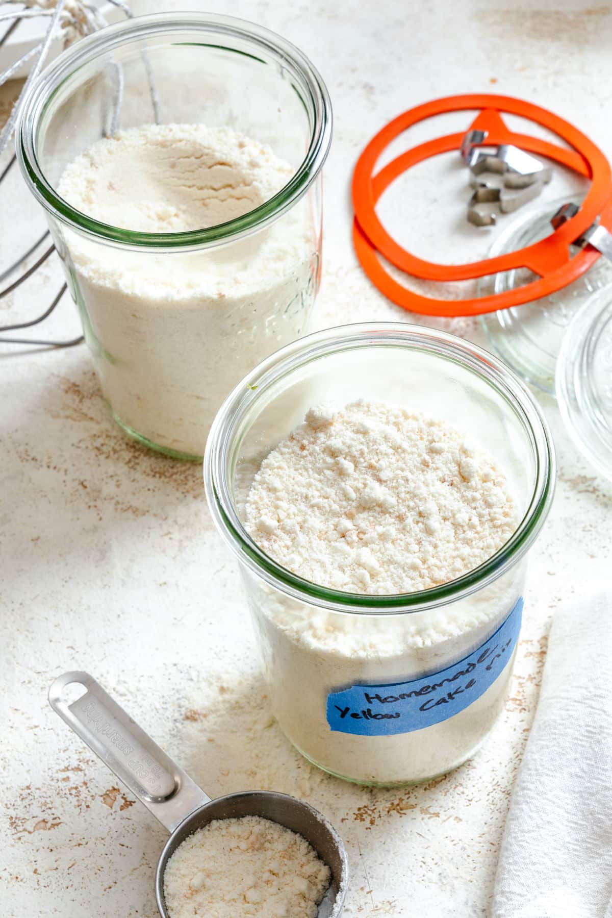 Homemade Yellow Cake Mix Two open glass jars filled with homemade yellow cake mix.