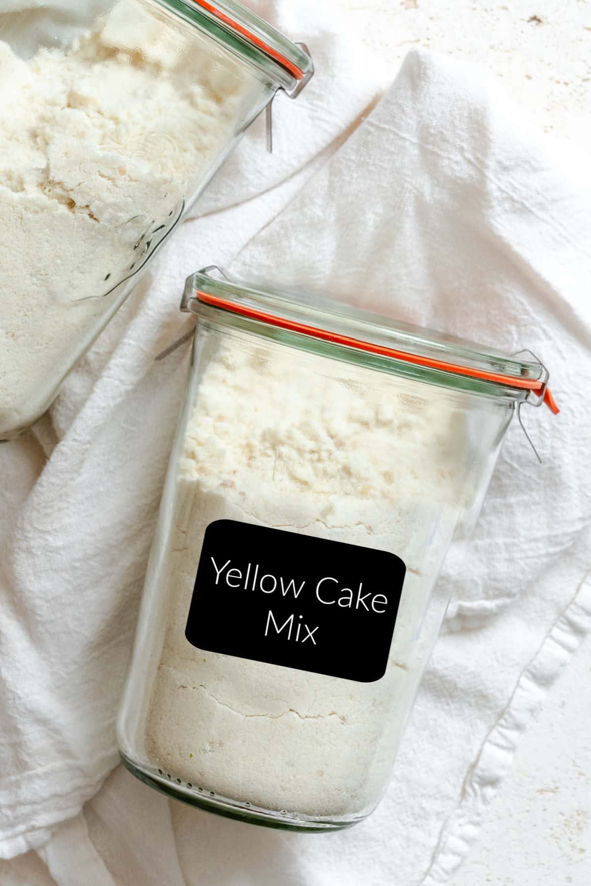 A jar of yellow cake mix with a label that says yellow cake mix.