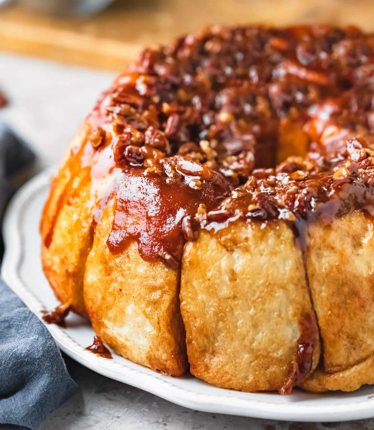 A plate of overnight sticky buns made in a tube pan.