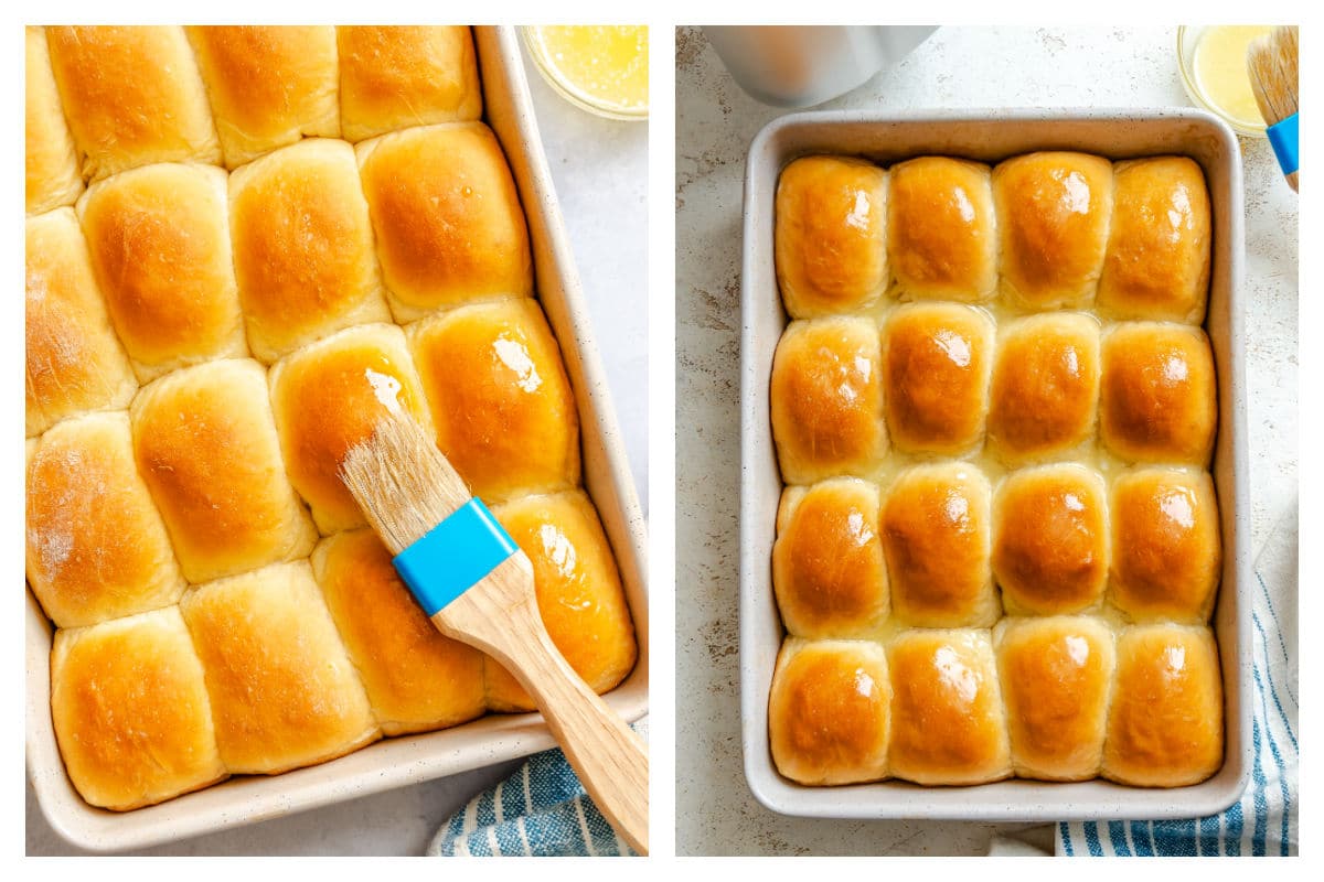 A basting brush brushing the rolls with butter next to a pan of baked rolls. 