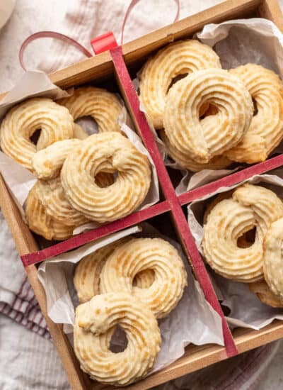 Danish butter cookies in a wooden box tied with red ribbon.