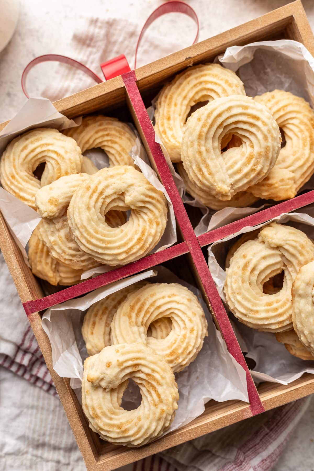 Danish butter cookies in a wooden box tied with red ribbon.