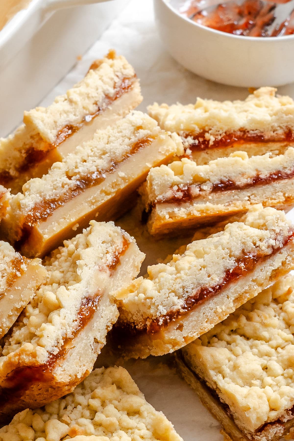 Jam bars on their side next to a dish of jam.