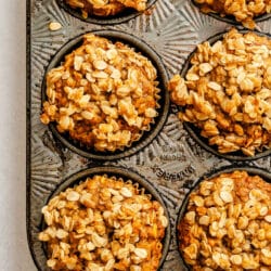 Baked banana oatmeal muffins in a muffin tin.