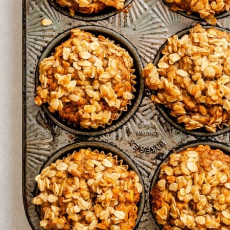 Baked banana oatmeal muffins in a muffin tin.