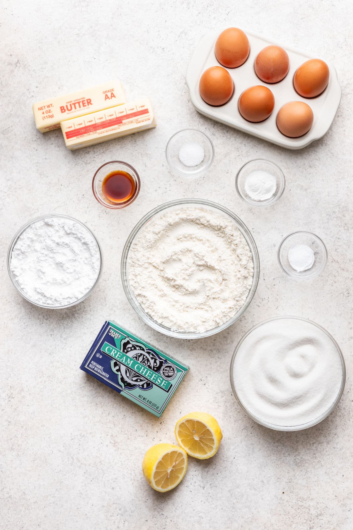 Ingredients for lemon pound cake and icing in dishes.