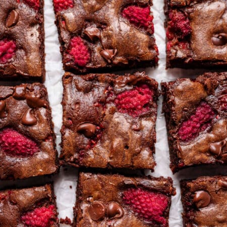 Rows of cut chocolate raspberry brownies.