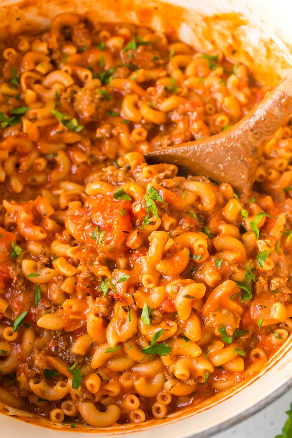 Homemade Hamburger Helper A wooden spoon in a pot of homemade hamburger helper.