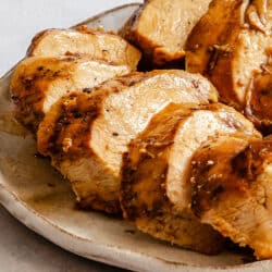 Sliced grilled Margarita-marinated chicken on a plate.