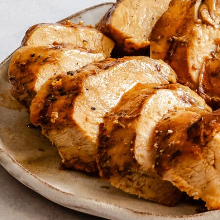 Sliced grilled Margarita-marinated chicken on a plate.