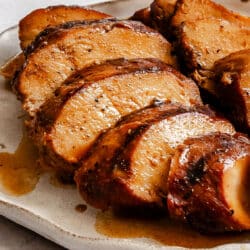 Teriyaki marinated grilled chicken on a plate.