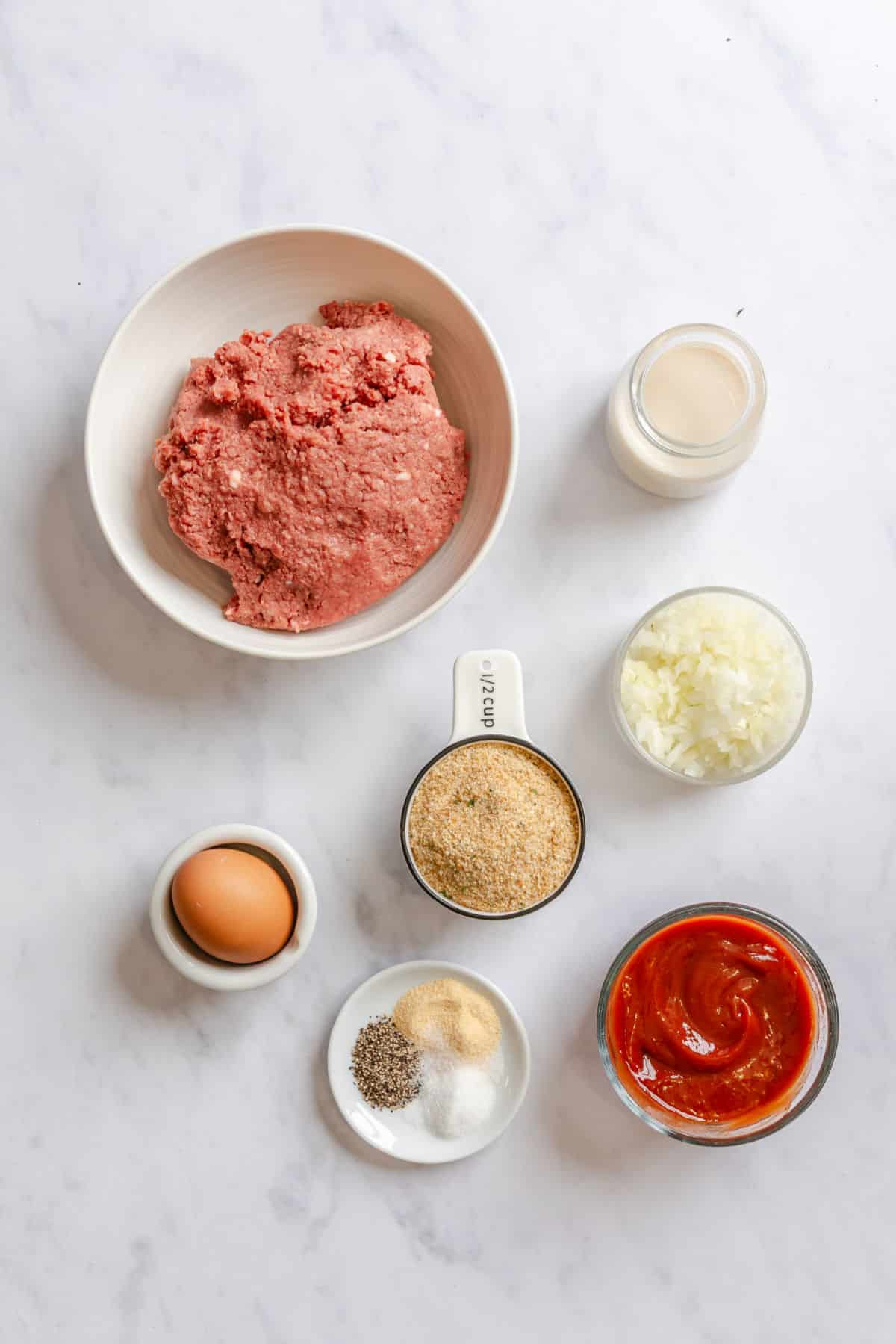 Ingredients for meatloaf in dishes.