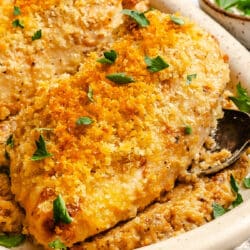 Baked Caesar chicken on a platter.