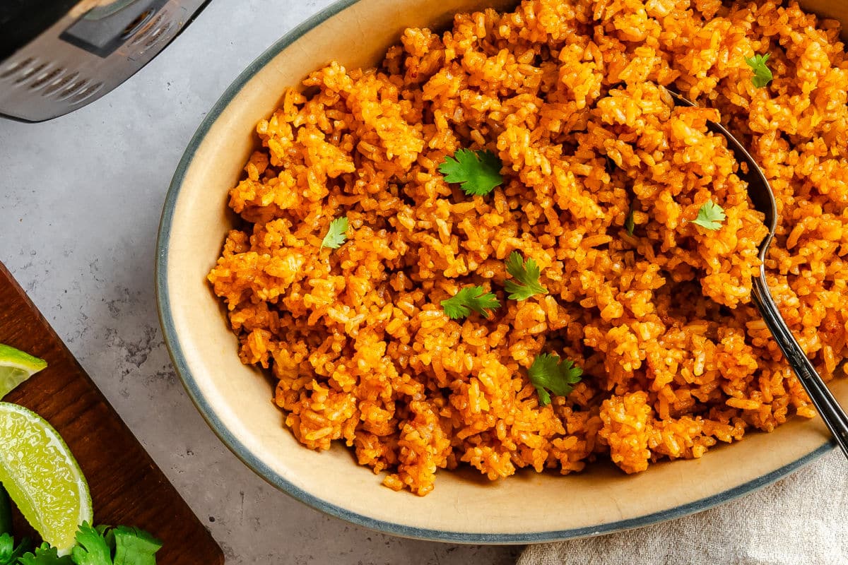 A dish of Instant Pot Mexican rice topped with cilantro.