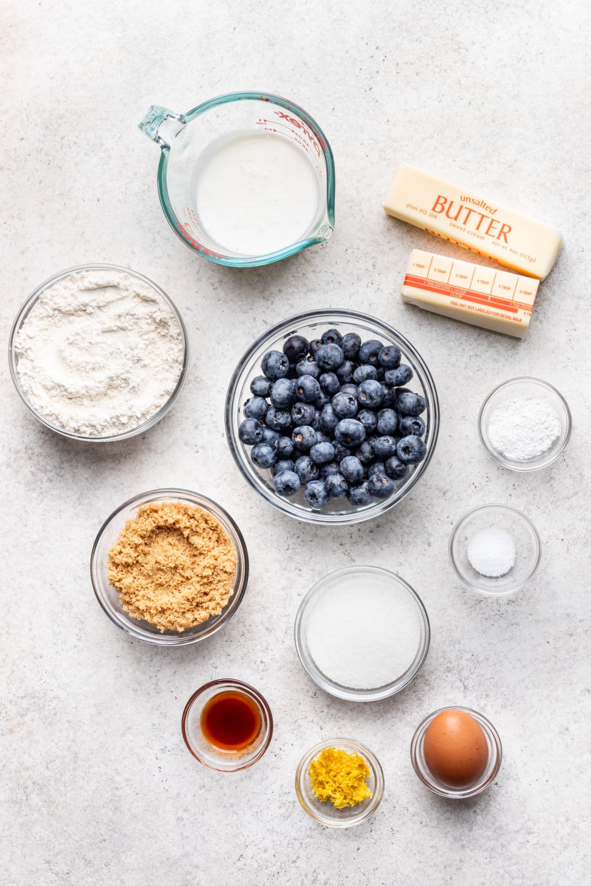 Ingredients for blueberry streusel muffins in dishes.